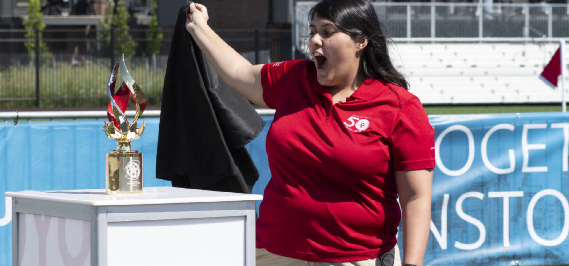 Athlete leader Emanuelle “Manu” Dutra Fernandes de Souza reveals the trophy during the Special Olympics Unified Cup Detroit 2022 Opening Ceremony held on 31 July 2022. de Souza, from Brazil, was party of the trophy design team.